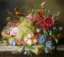 Nature morte avec des fruits et des fleurs sur un bord de table