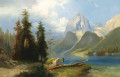 Chasseur au bord d'un lac de montagne