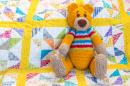 Teddy Bear on a Quilted Duvet Cover