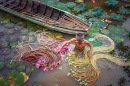 Vietnamien cueille un lotus rose