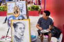 Artiste de rue à Hochiminh, Vietnam
