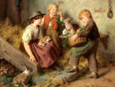 Enfants avec les lapins dans l’écurie