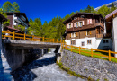 River and Chalet In Swiss Village In Alps, Leukerbad, Leuk, Visp, Wallis, Valais Switzerland