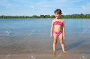 171745489-little-girl-in-a-pink-bathing-suit-on-the-river-on-a-sunny-warm-day