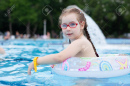 154058298-girl-with-glasses-swimming-in-the-pool